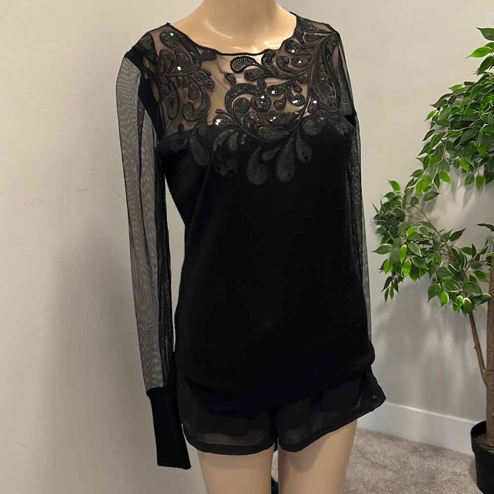 shiny black sequins with a see through sleeve blouse . size 2